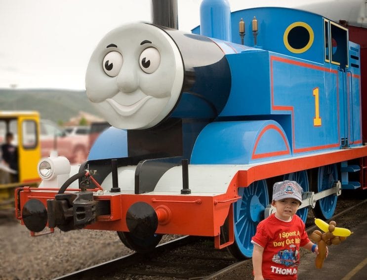 Child standing in front of Thomas the Tank Engine