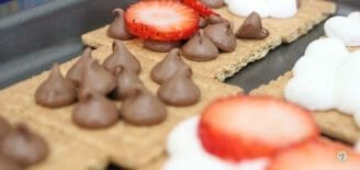 strawberry toppers on baked berry S'mores