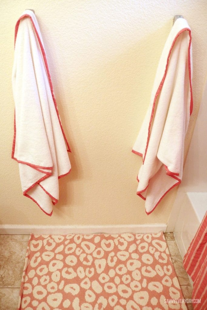 hanging towels over spot rug