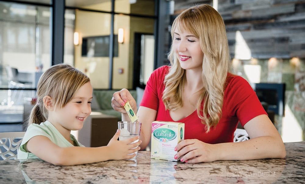 smiling and pouring in culturelle probiotic