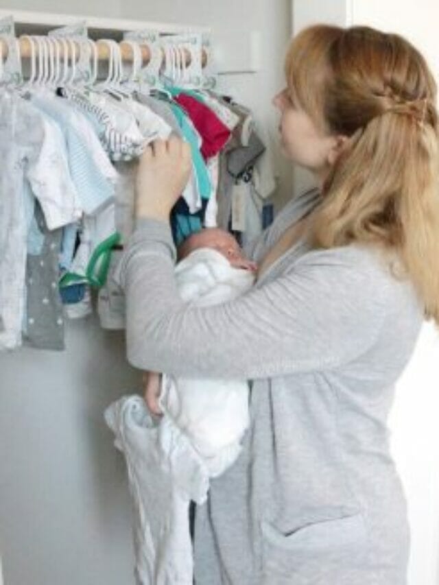 looking at clothes in closet_logo