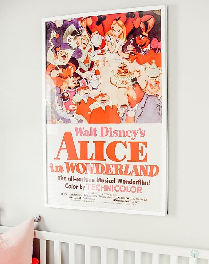 Vintage Alice in Wonderland poster on the wall of the nursery