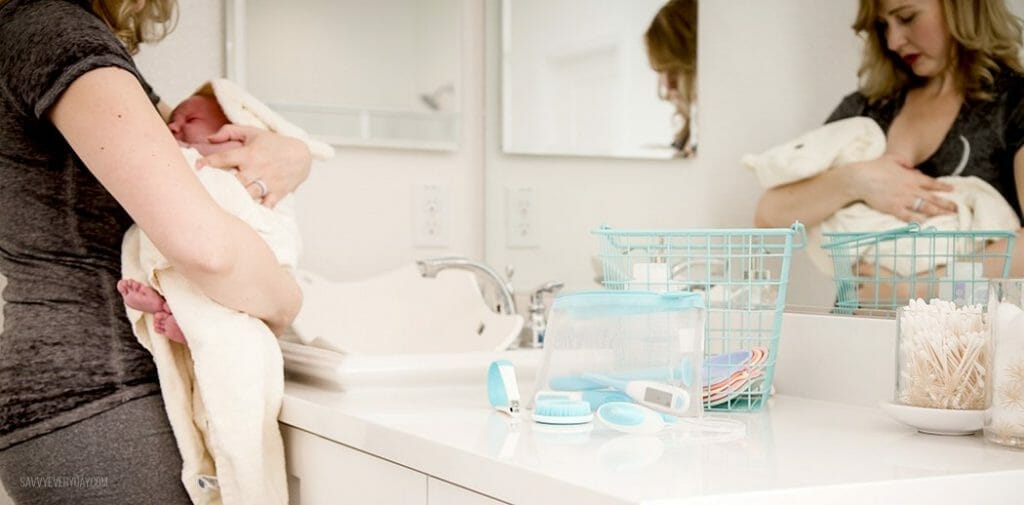 holding baby after bath