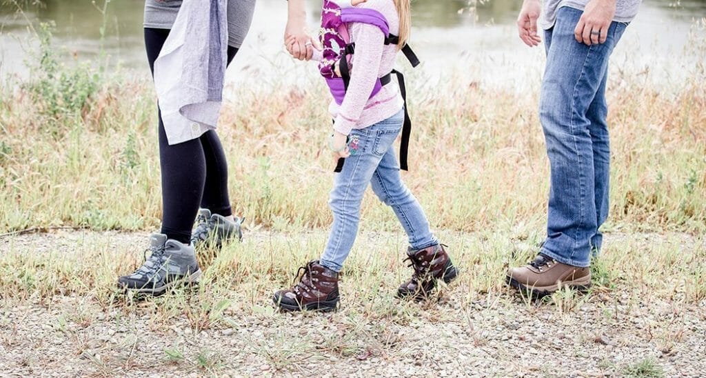 hiking as a family and holding hands