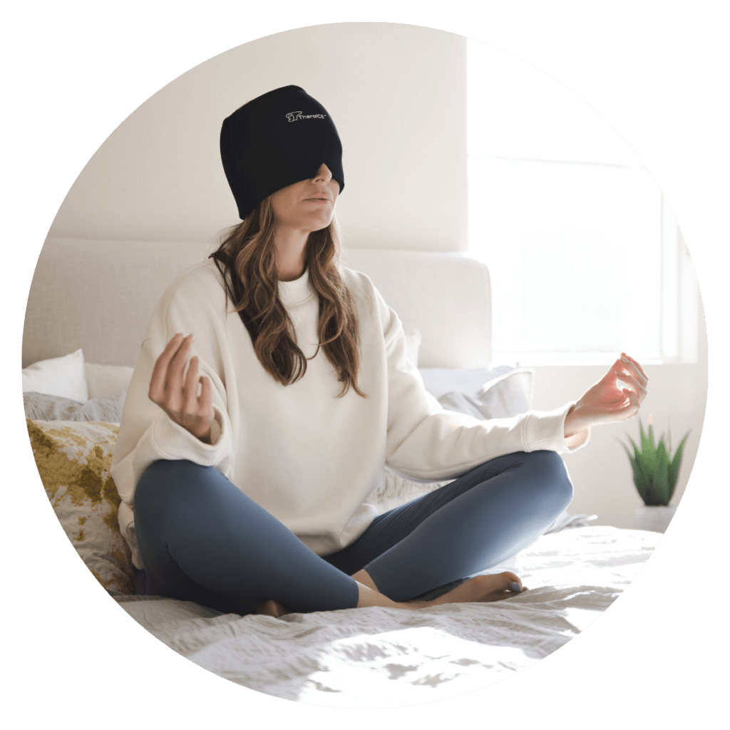 Woman on bed with TheraICE Hot & Cold Therapy Head Cap on her head