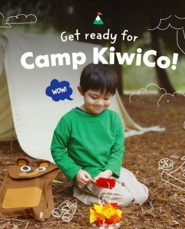 Little boy smiles down at his DIY pretend campfire outside "Get Ready for camp kiwico"
