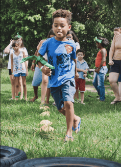 kids running outdoor relay race