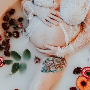 pregnant mom in floral milk bath