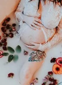 pregnant mom in floral milk bath