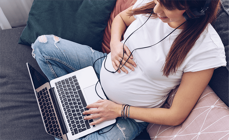pregnant mom at laptop