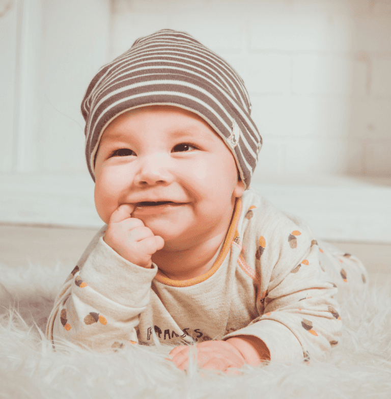 baby teething on his finger