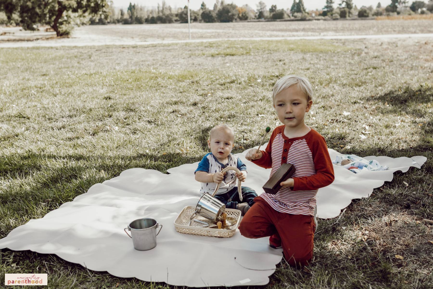 Baby and brother play instruments