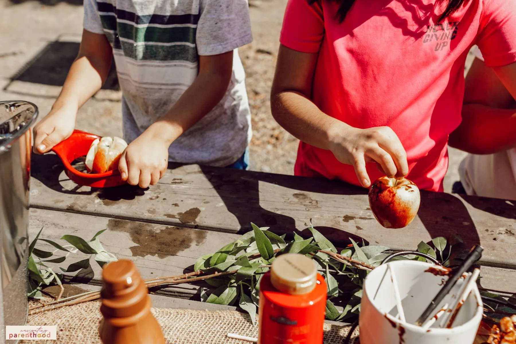 Kids cutting and decorating apples