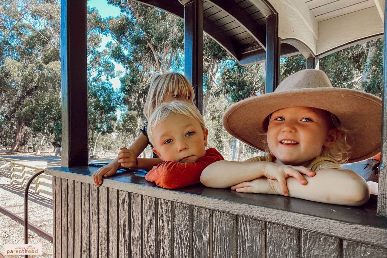 kids on train ride at a Wild West first birthday party