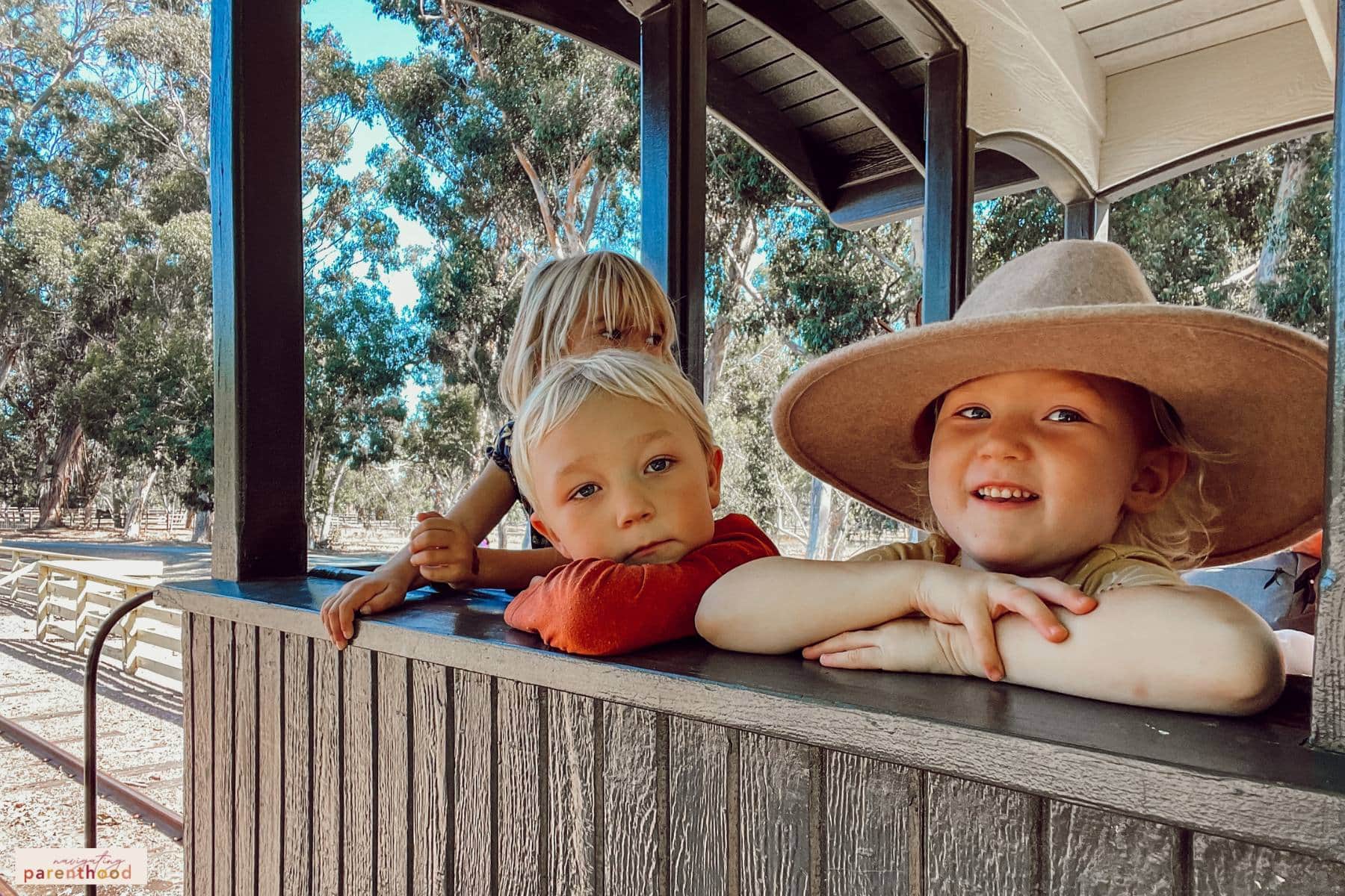 kids on train ride at a Wild West first birthday party