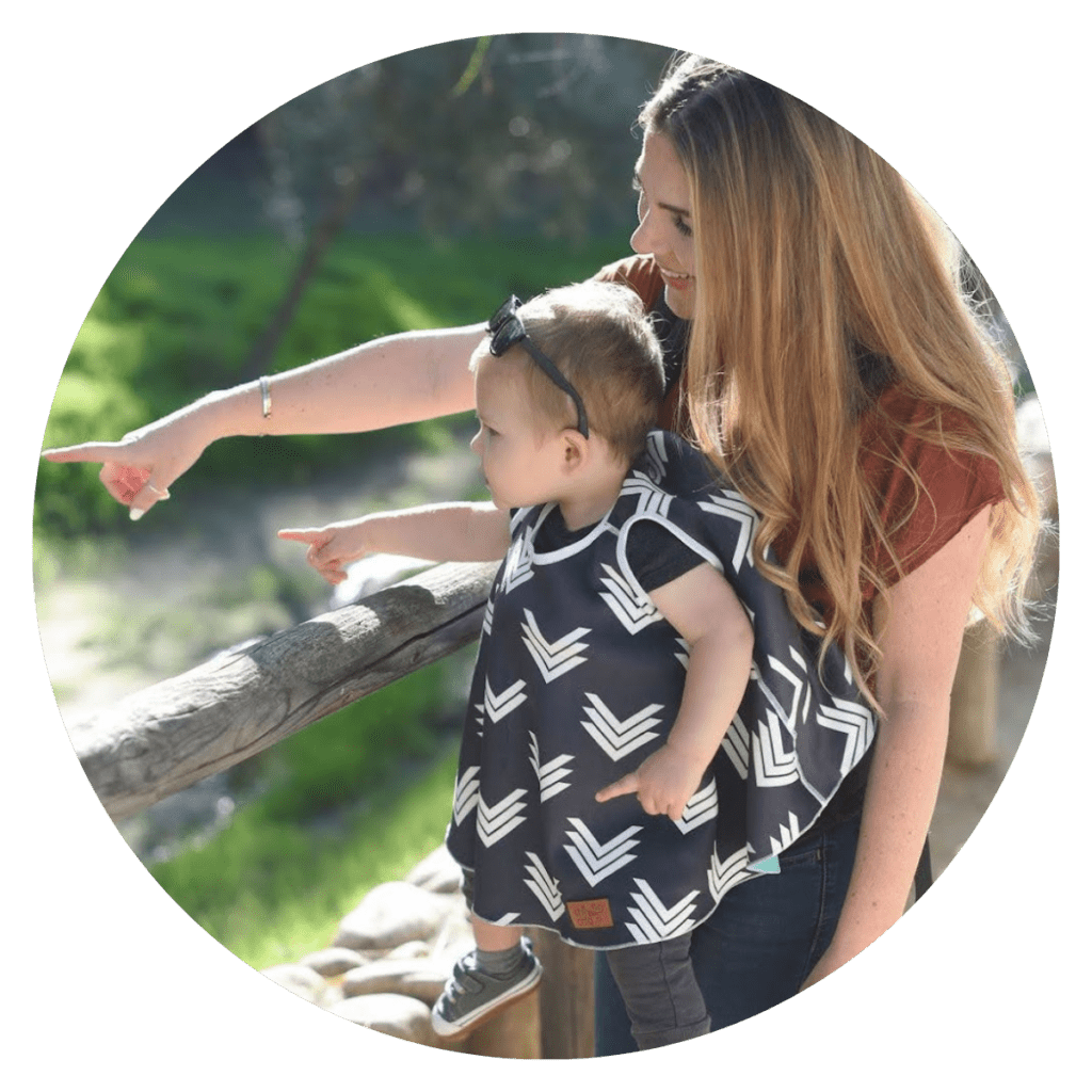 baby in chilly child cover at zoo with mom on family trip