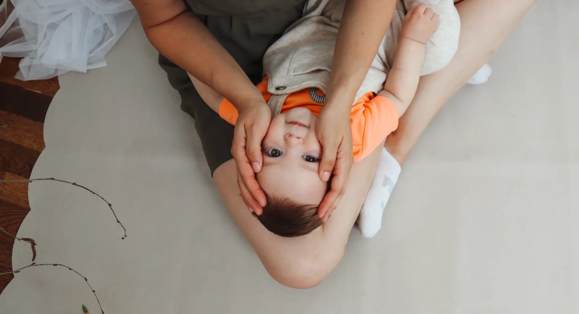 Upside down baby face massage